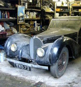 dusty vintage car in garage